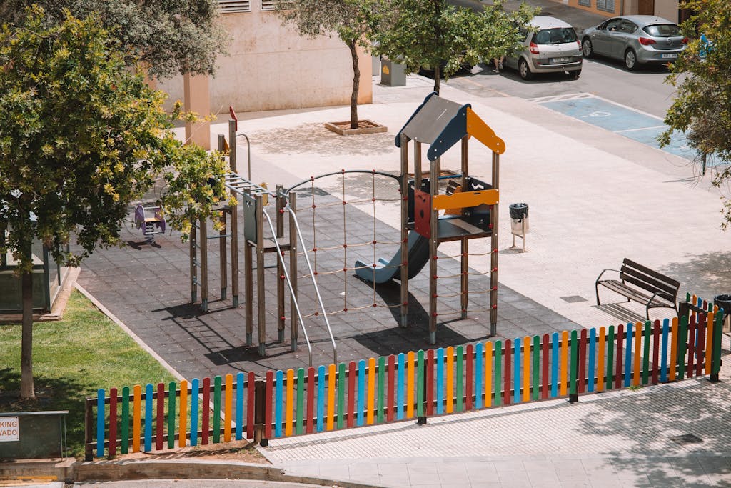 The 630 Area Aerial view of a colorful playground with a slide in Valencia, Spain.