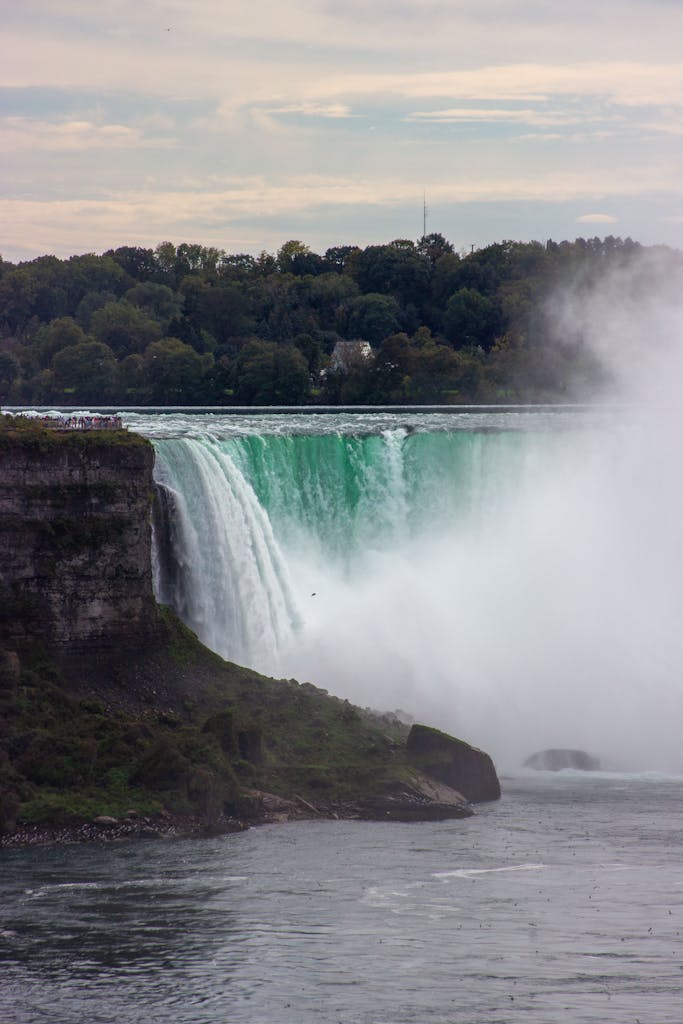 TheGlobeAndMail Captivating scene of Niagara Falls with mist and lush surroundings in Ontario, Canada.