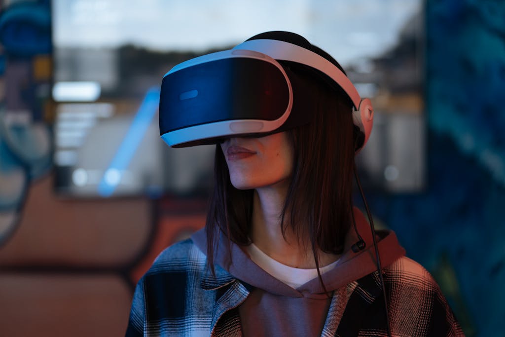 Sixmagazine Young woman exploring virtual reality with VR headset indoors, surrounded by colorful lights.