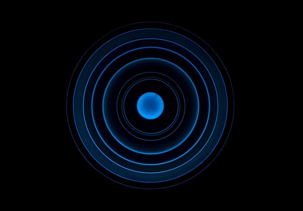 digitalconnectmag.com blue concentric circle pattern on a black background, ideal for futuristic designs.