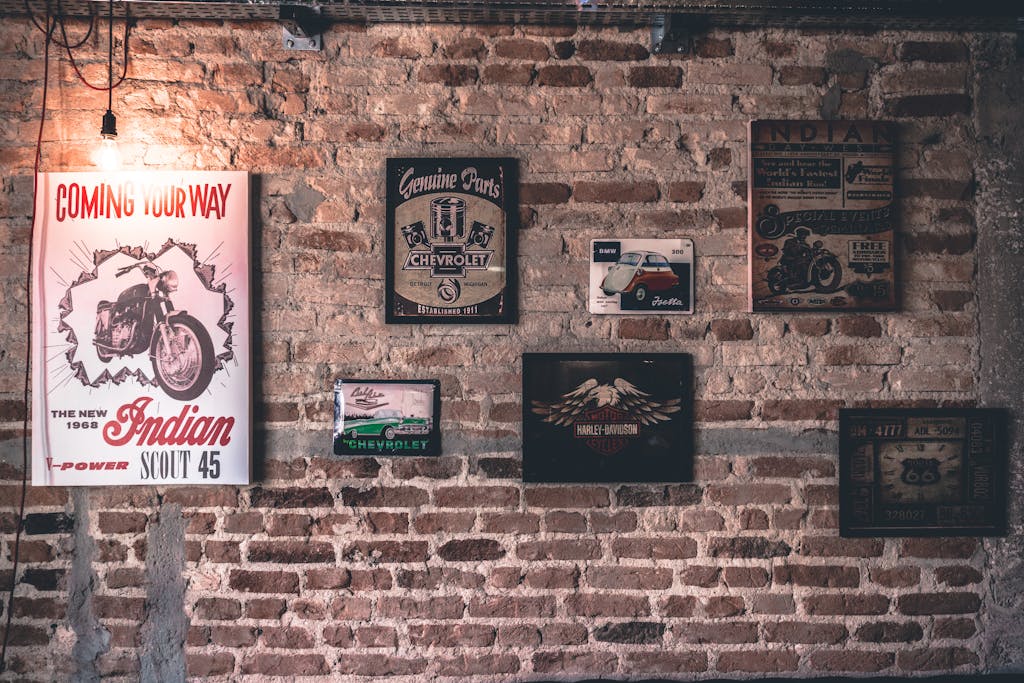Calesshop Retro wall art featuring motorcycle and car signs on a rustic brick wall.