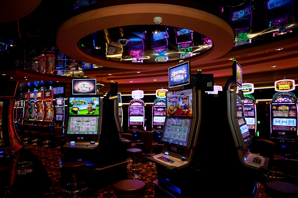 VNorsk Casino ibrant casino floor with colorful slot machines and bright lights capturing a lively gaming atmosphere.